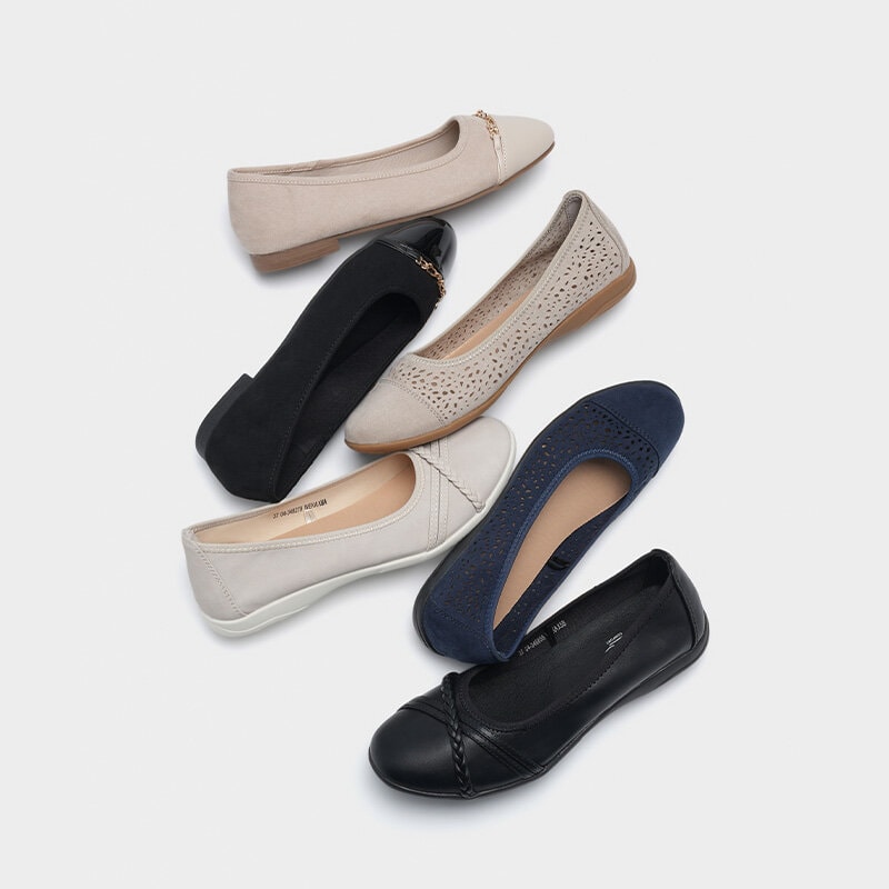 Ballerinaskor liggandes brevid varandra i flera olika färger