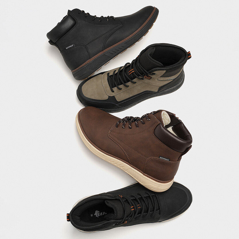 Bruna och svarta kängor till herr